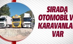 SIRADA OTOMOBİL VE KARAVANLAR VAR