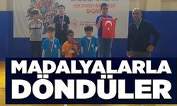 MADALYALARLA DÖNDÜLER