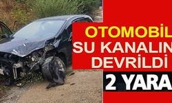 OTOMOBİL SU KANALINA DEVRİLDİ: 2 YARALI