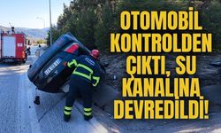 KONTROLDEN ÇIKAN OTOMOBİL SU KANALINA DEVRİLDİ
