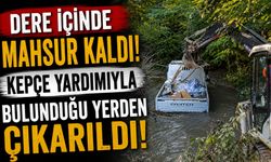 PATLAYAN BORU KAMYONETİ DERE İÇİNDE MAHSUR BIRAKTI
