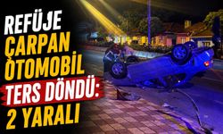 REFÜJE ÇARPAN OTOMOBİL TERS DÖNDÜ: 2 YARALI