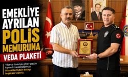 EMEKLİYE AYRILAN POLİS MEMURUNA VEDA PLAKETİ