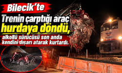 TRENİN ÇARPTIĞI ARAÇ HURDAYA DÖNDÜ, ALKOLLÜ SÜRÜCÜSÜ SON ANDA KENDİNİ DIŞARI ATARAK KURTARDI