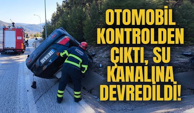 KONTROLDEN ÇIKAN OTOMOBİL SU KANALINA DEVRİLDİ