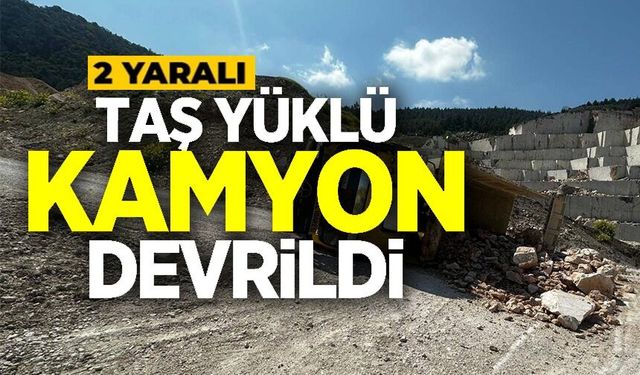 TAŞ YÜKLÜ KAMYON DEVRİLDİ: 2 YARALI