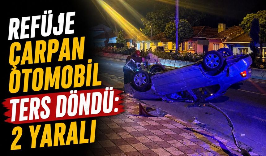 REFÜJE ÇARPAN OTOMOBİL TERS DÖNDÜ: 2 YARALI